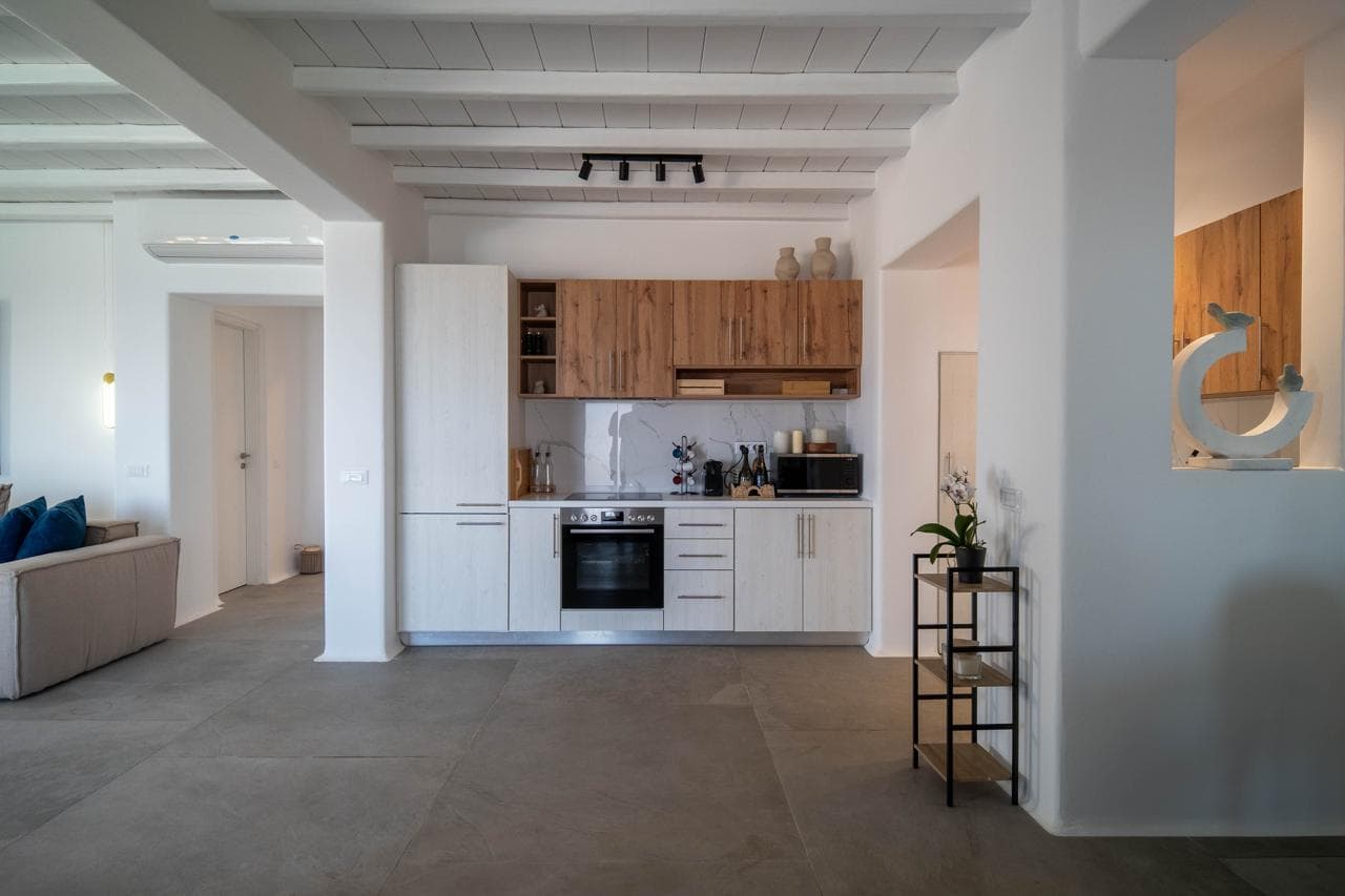Open-plan kitchen with oak cabinetry and modern appliances