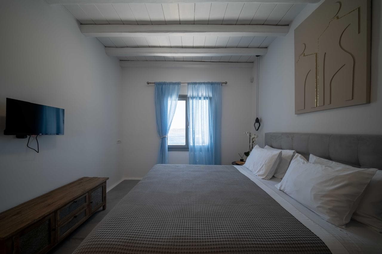 Serene double bedroom with soft grey textiles