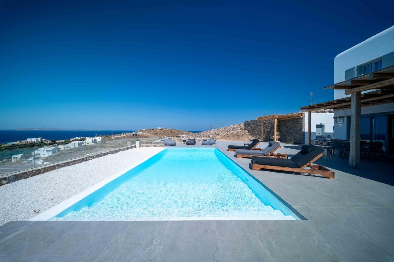 Infinity pool overlooking the deep blue Aegean Sea