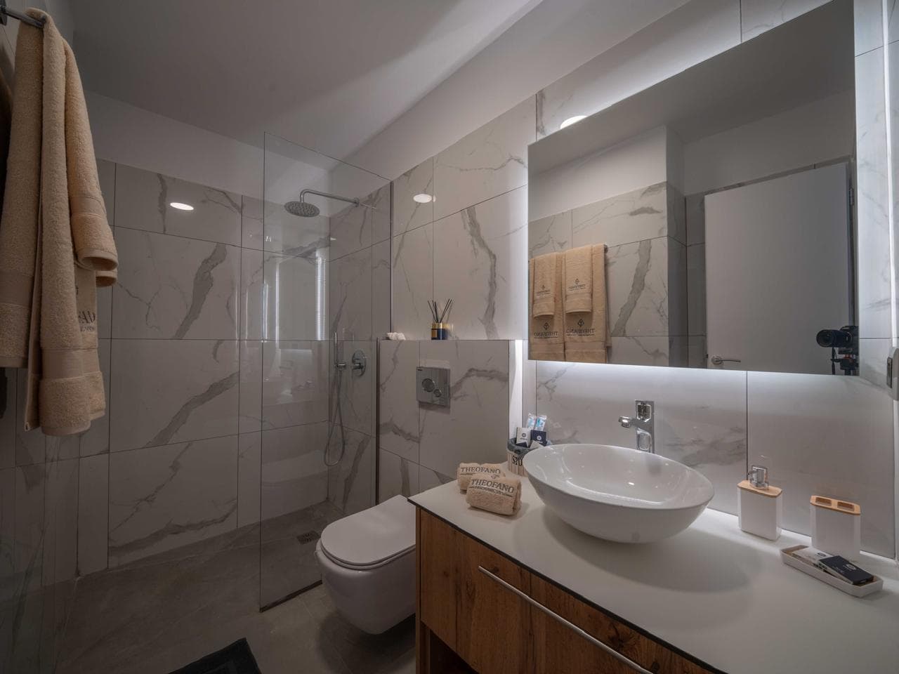 Marble-clad bathroom with double vanity
