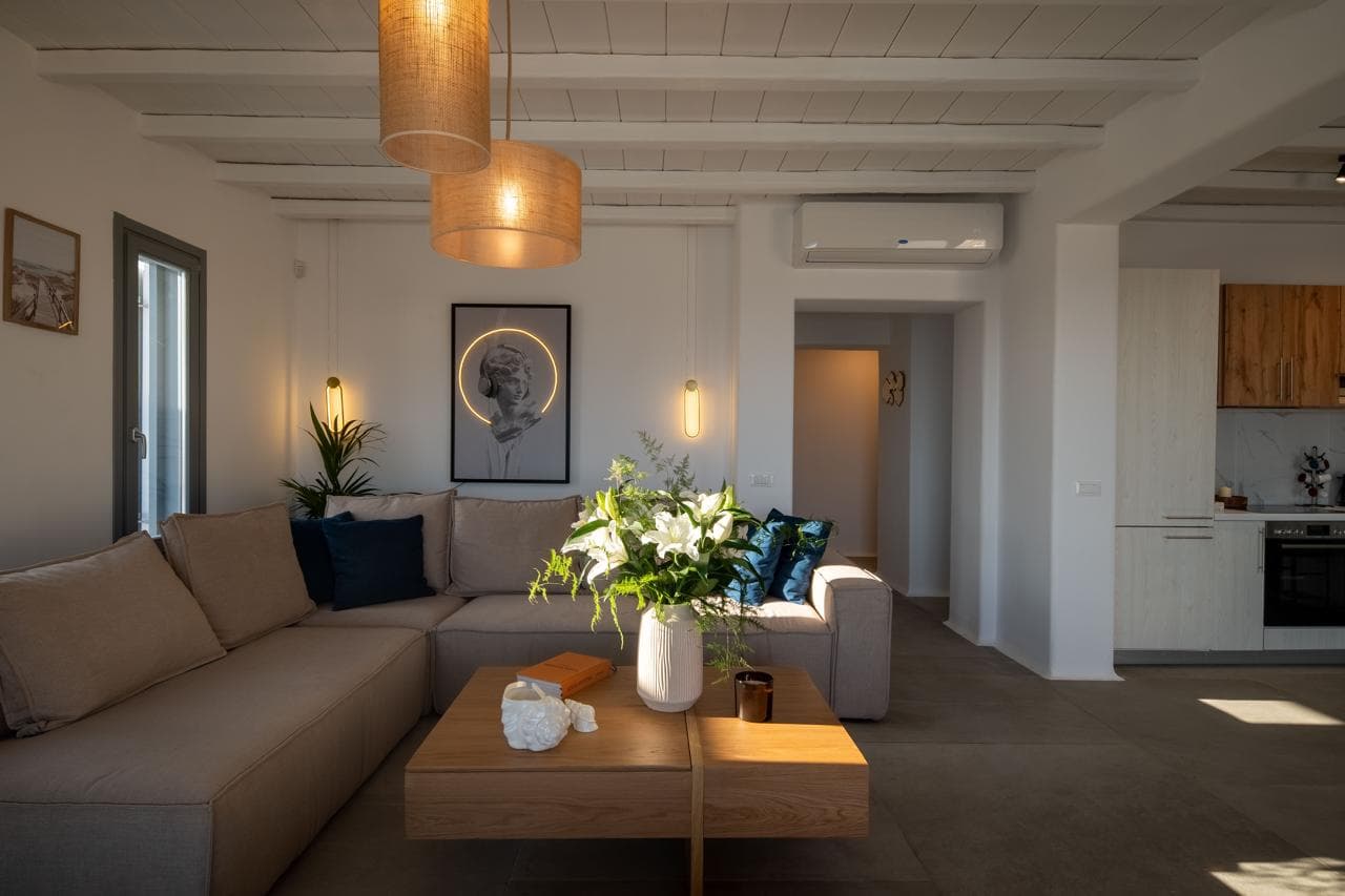 Living area with linen sofas and open kitchen