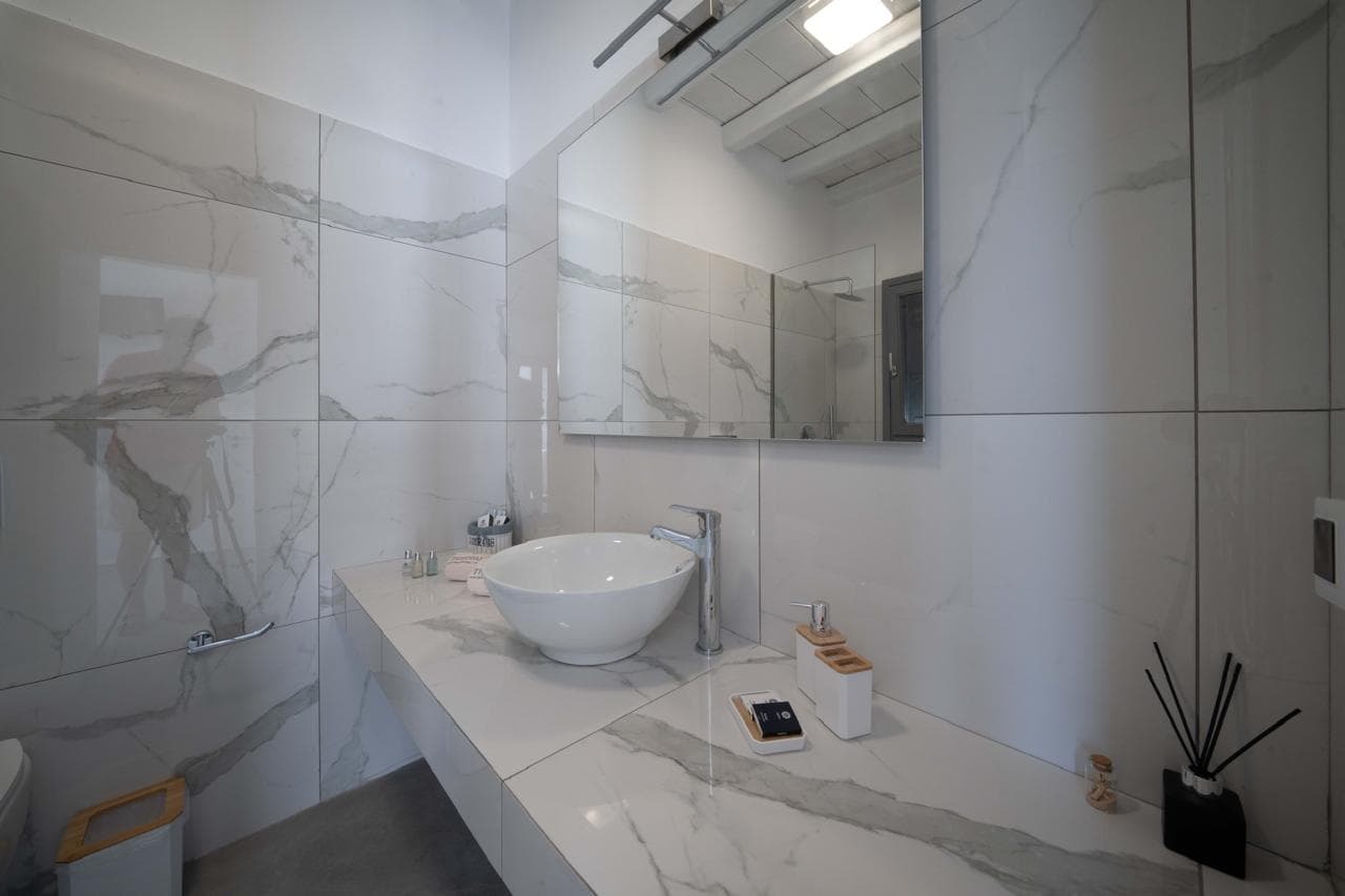 Marble bathroom with countertop basin