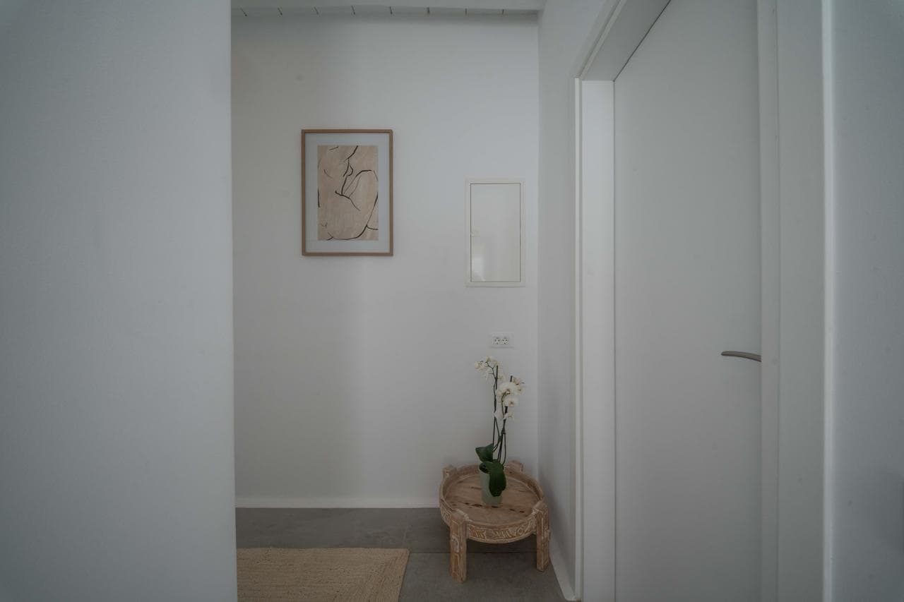 Entrance hall detail with white orchid