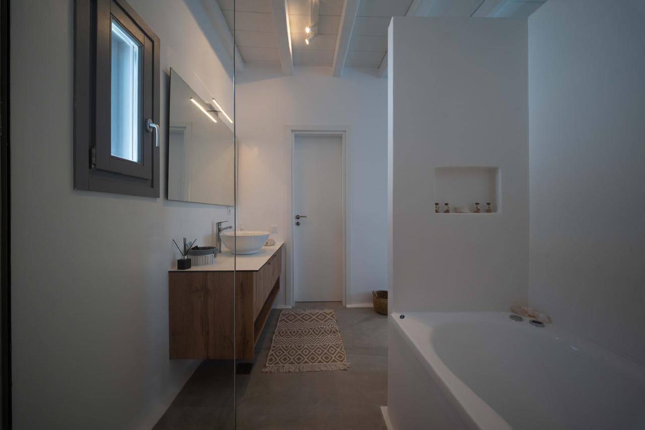 Neutral-toned bathroom with bathtub