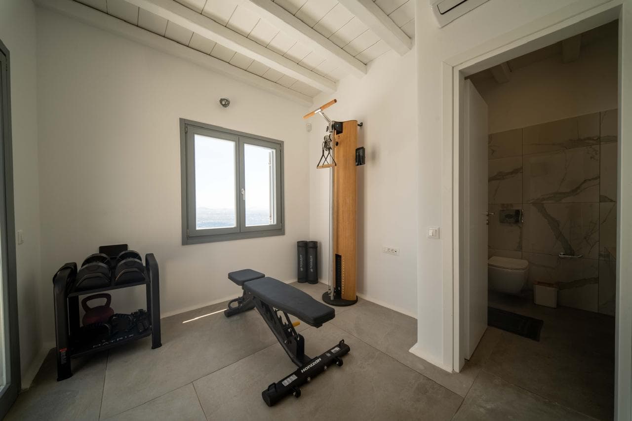 Private gym with weights and training bench