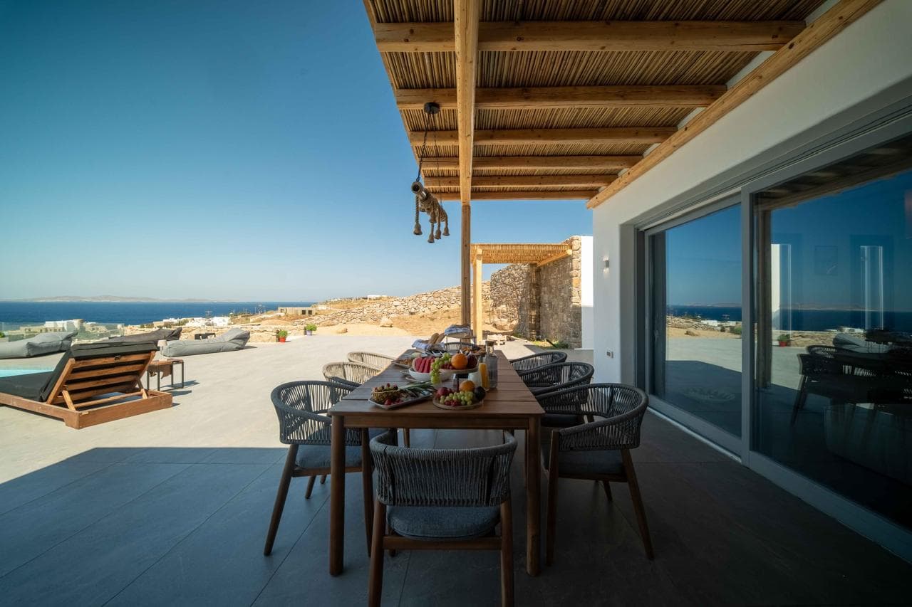 Al fresco dining under the pergola beside the pool