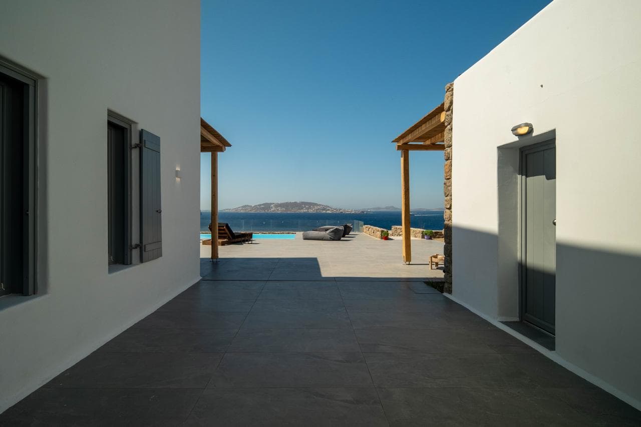 Exterior passage with a glimpse of the Aegean