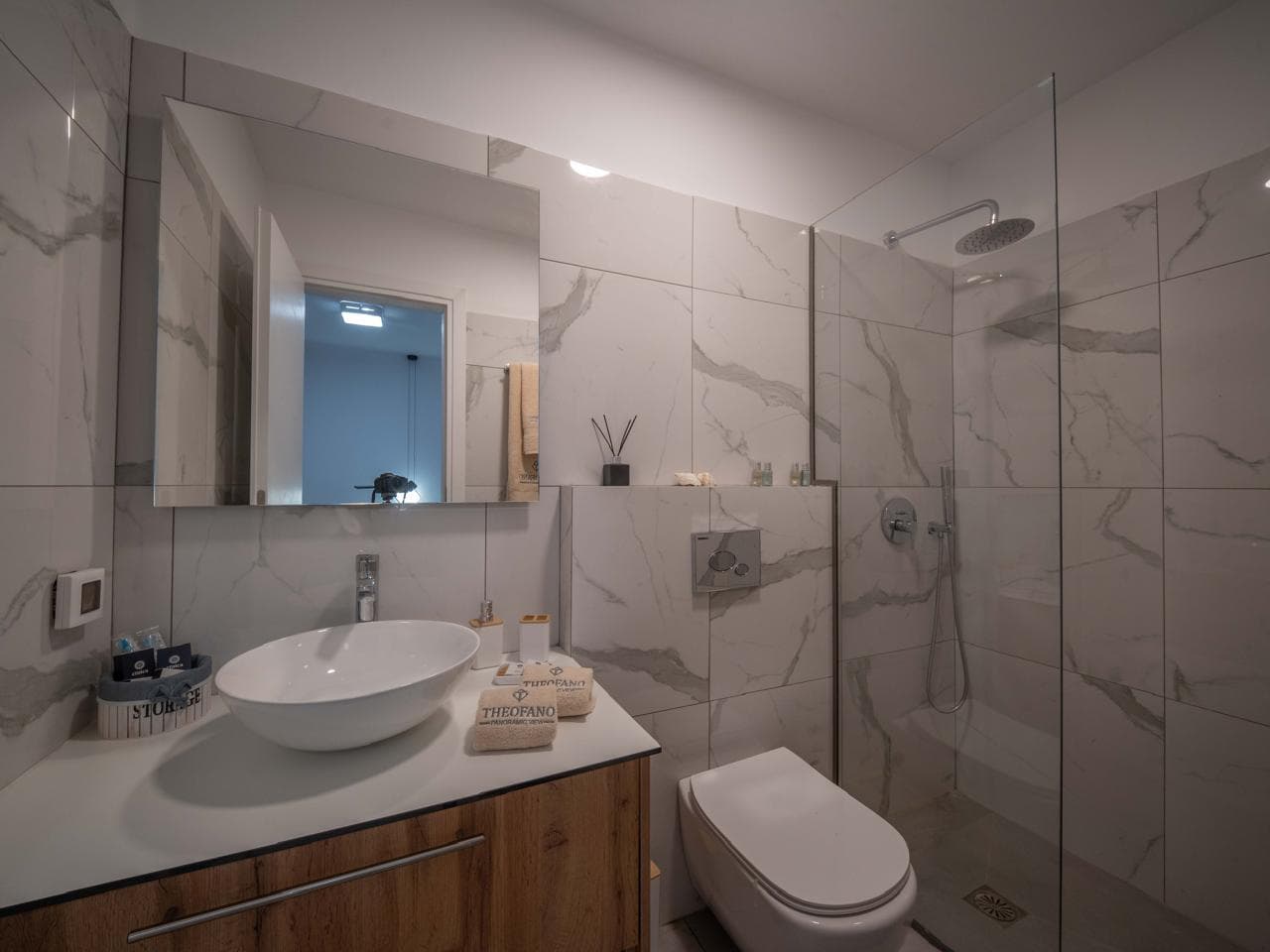 Marble bathroom with mirror cabinet