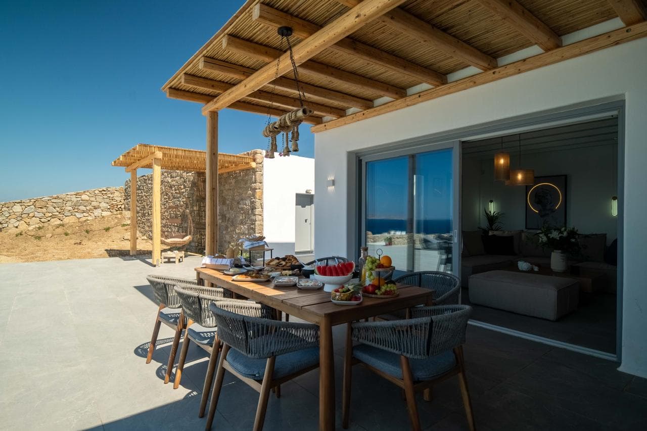 Breakfast served al fresco under the pergola